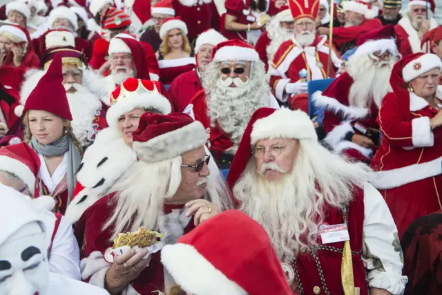 People dressed as Santa Claus