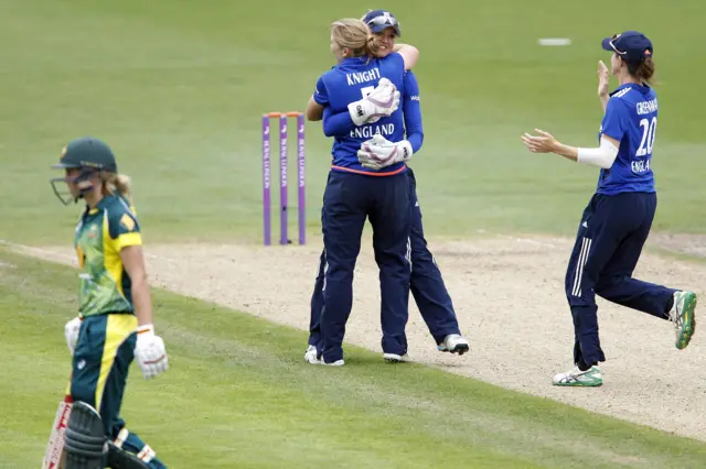 England celebrate taking the wicket of Healy