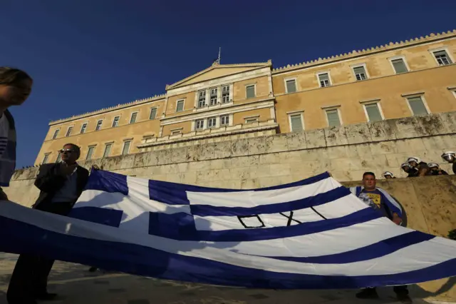 Greek flag in front on Syntagma Square