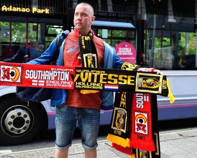 A Southampton and Vitesse scarf ahead of their Europa League game