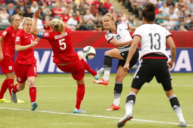 Lena Petermann sees her shot blocked by Steph Houghton