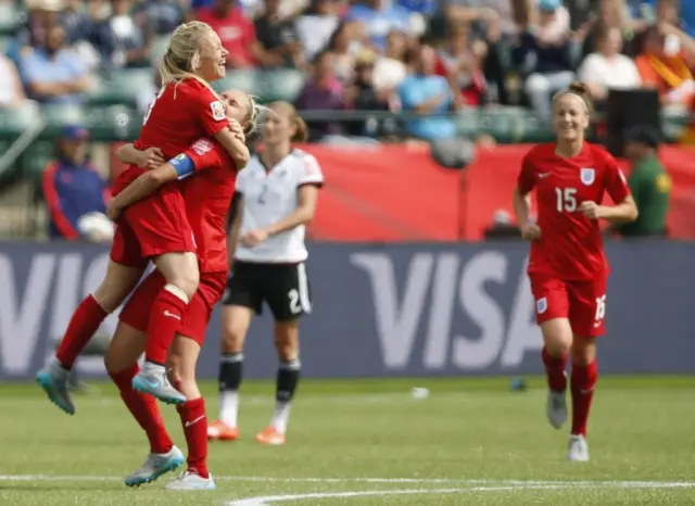 Laura Bassett celebrates