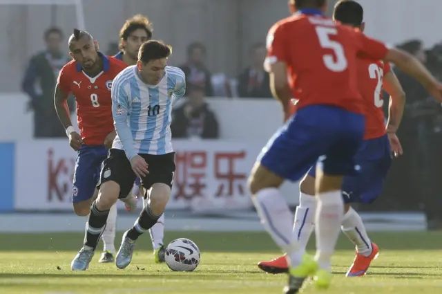 Lionel Messi advances with the ball