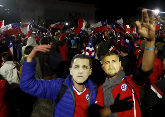 Chile fans in Alexis Sanchez and Arturo Vidal masks