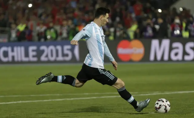 Lionel Messi takes a penalty