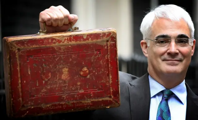 Chancellor of the Exchequer Alistair Darling holds Disraeli"s original Budget box outside number 11 Downing Street 24 March 2010