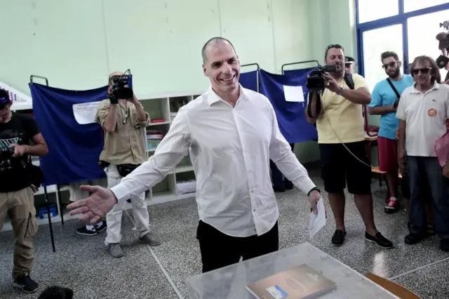 Greek Finance Minister Yanis Varoufakis (C) prepares to cast his ballot during the Greek referendum in Athens 5 July 2015.