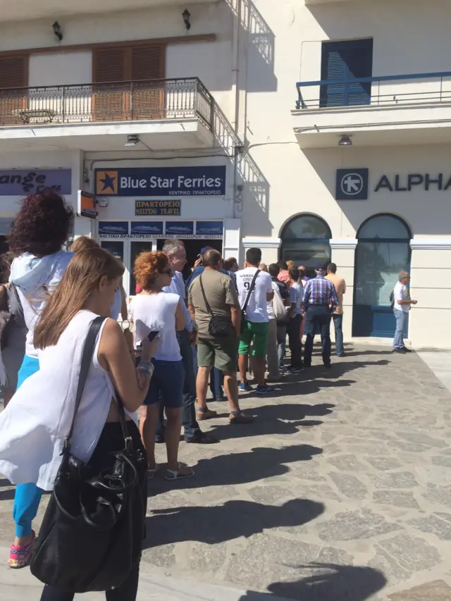 People queuing for an ATM in Paros, Greece