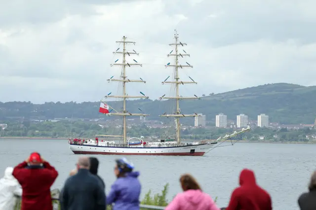 Public watch a Tall Ship leave Belfast Harbour