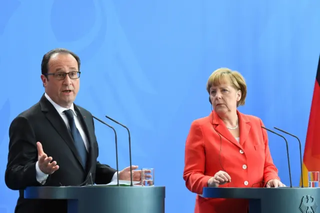 This photo taken on May 19, 2015 in Berlin shows French President Francois Hollande (L) and German Chancellor Angela Merkel after their meeting at the Chancellery.