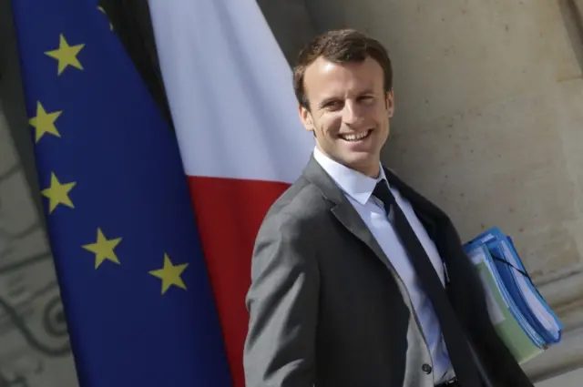 French Economy minister Emmanuel Macron leaves after the weekly cabinet meeting at the Elysee Palace in Paris, France, July 1, 2015.