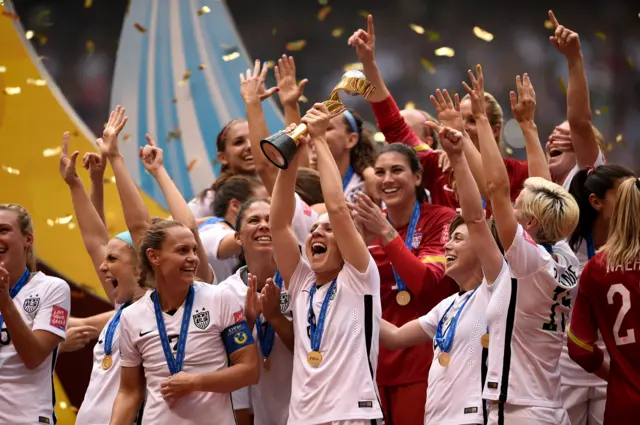 USA players celebrate with the trophy