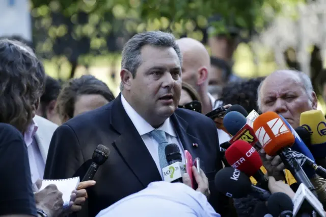 Greece"s Defense Minister Panos Kammenos speaks to the media after a meeting with the Greek political party leaders at the Presidential Palace in Athens, Monday, July 6, 2015.