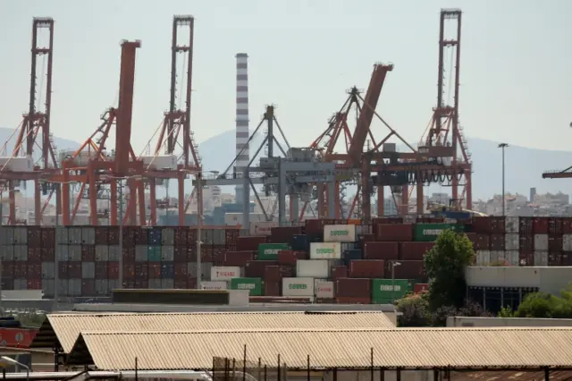 Cargo containers pile up at Piraeus seaport