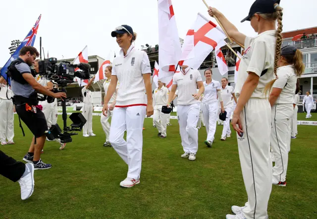 Charlotte Edwards leads England out