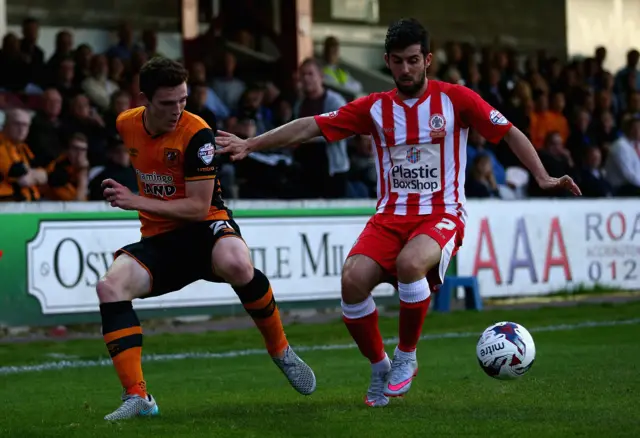 Piero Mingoia of Accrington Stanley in action with Andy Robertson