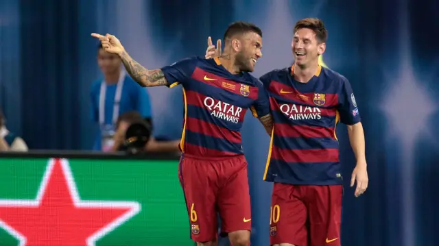 Lionel Messi celebrates with Dani Alves