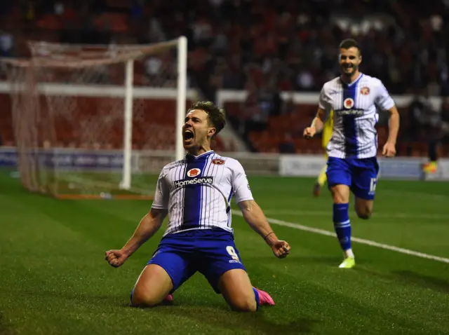 Tom Bradshaw celebrates