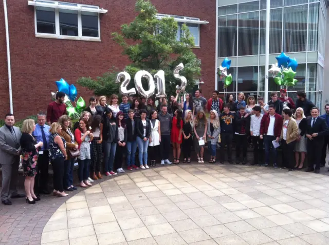 Students at Coleg Cambria in Wrexham pose for a celebration photo.