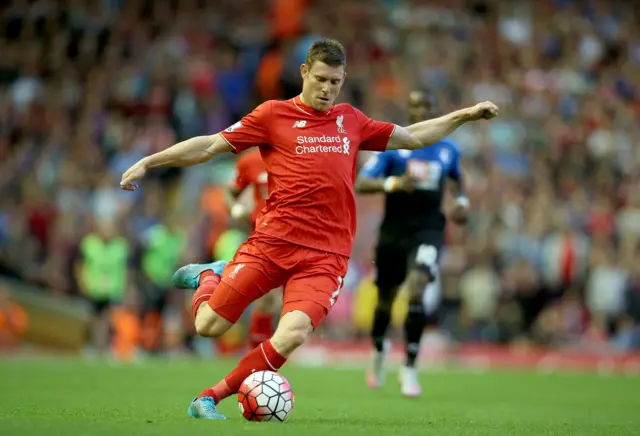 James Milner shoots