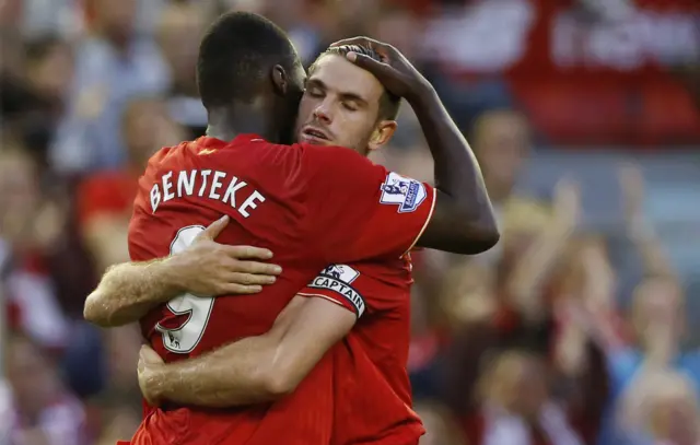 Jordan Henderson hugs goalscorer Christian Benteke