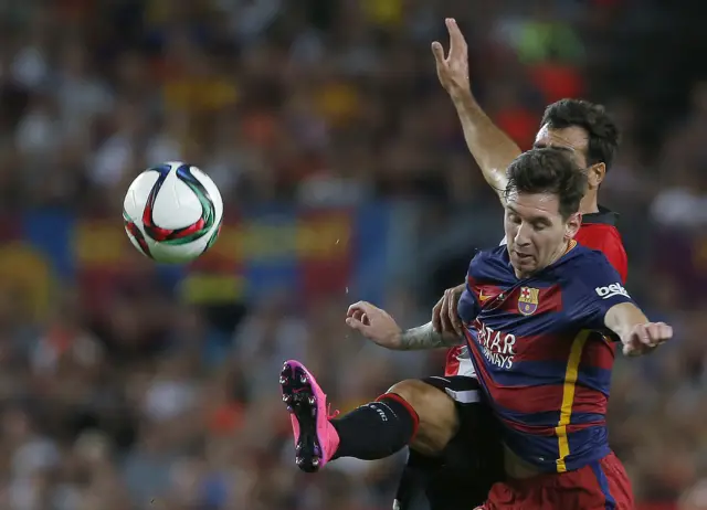 Messi battles for the ball