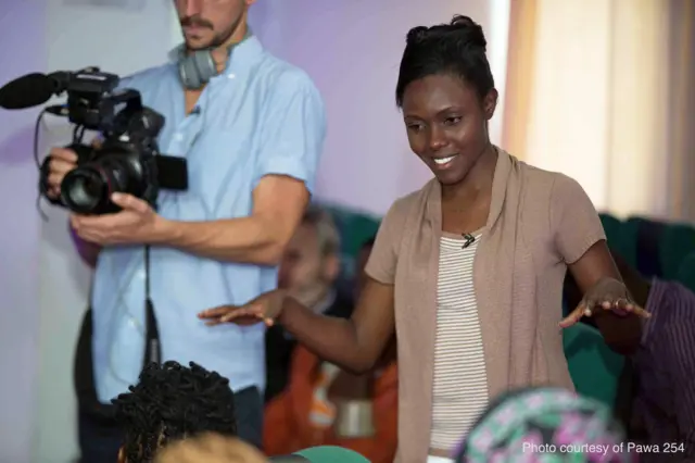 BBC Reporter Anne Soy speaking to a crowd