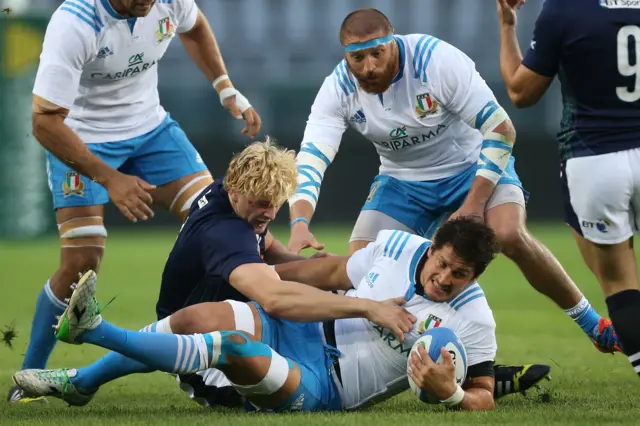 Richie Gray tackles Alessando Zanni