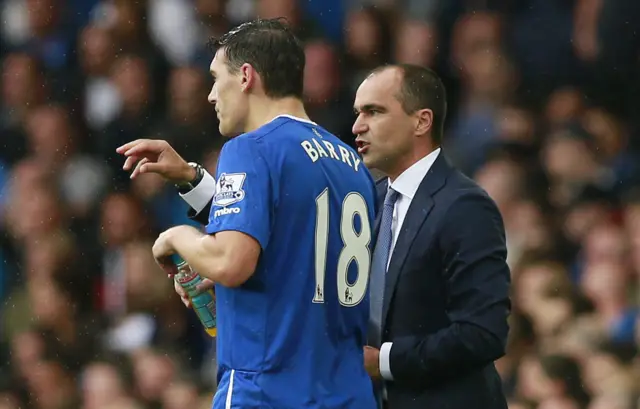 Roberto Martinez talks to Gareth Barry