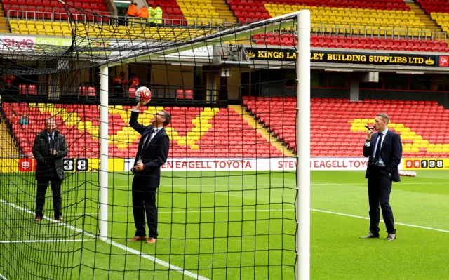 Referee Andre Marinner tests Hawk-eye at Watford's Vicarage Road