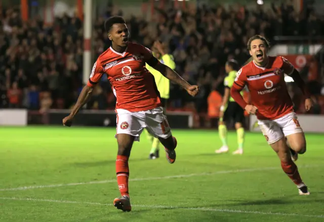 Rico Henry celebrates