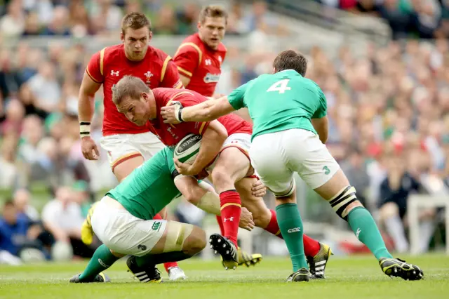 Ireland's Peter O'Mahony and Iain Henderson tackle Gethin Jenkins of Wales