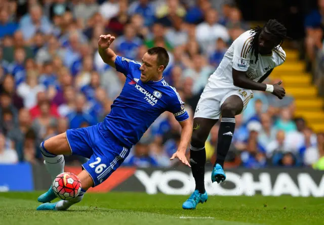 Bafetimbi Gomis shot is blocked by John Terry