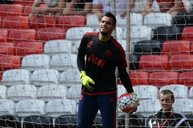 Sergio Romero warms up
