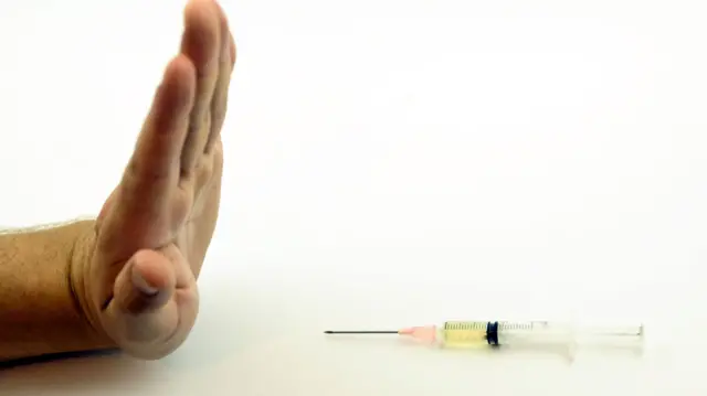 A hand and a needle