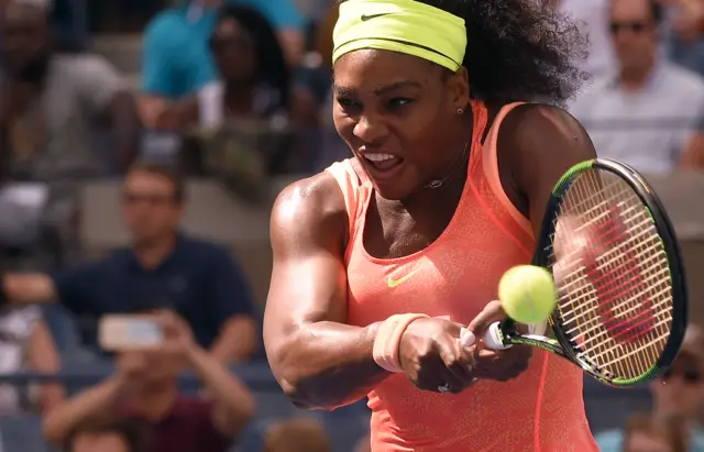 Serena Williams plays a backhand