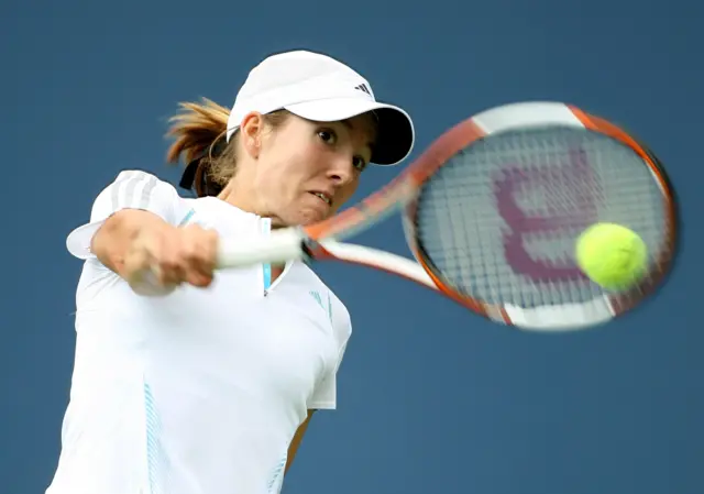 Justine Henin plays a one-handed backhand