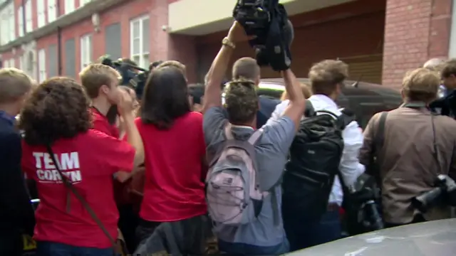 Media scrum as Jeremy Corbyn leaves the pub