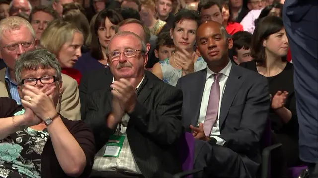 Chuka Umunna and other Labour MPs look on as Mr Corbyn speaks