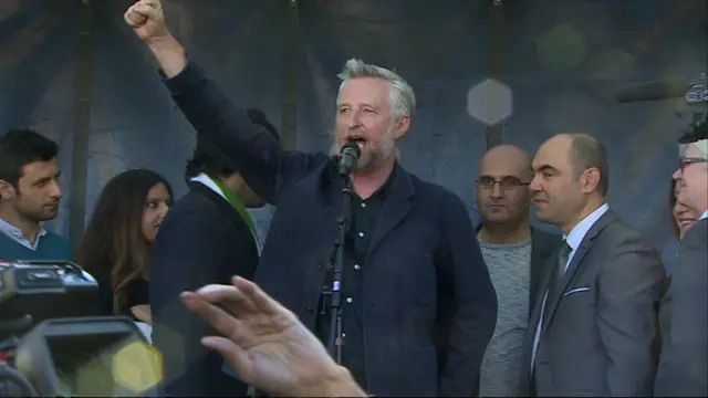 Billy Bragg sings The Red Flag at refugee rally in central London