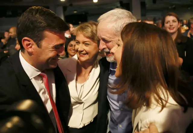 The four candidates have a group hug to congratulate winner Jeremy Corbyn