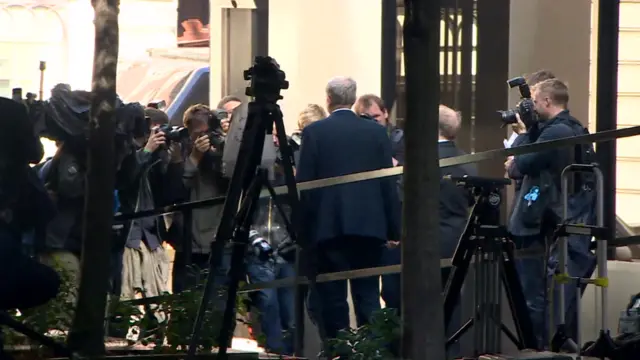 Jeremy Corbyn being photographed as he leaves Labour's headquarters