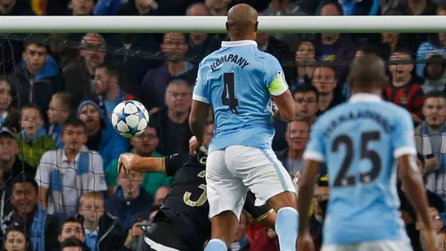 Kompany challenges for the ball