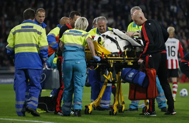 Luke Shaw is treated by medics