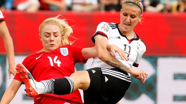 Alex Greenwood (left) playing against Germany