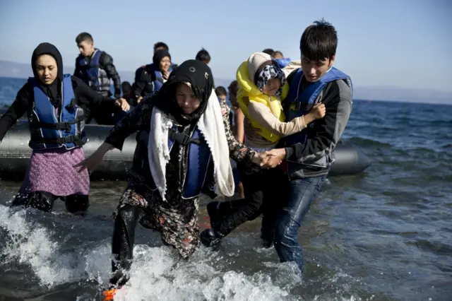 Migrants arriving on boat