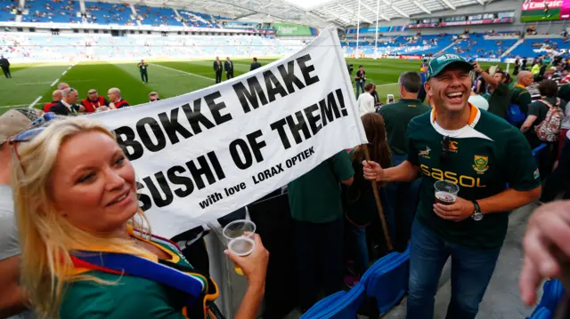 South Africa fans hold up sign