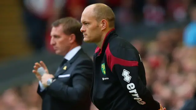 Alex Neil and Brendan Rodgers watch action