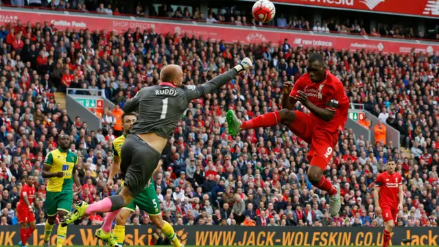 John Ruddy punches clear a shot