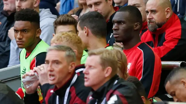 Christian Benteke watches play from the bench